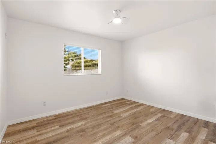 Empty room featuring light wood-style floors and baseboards