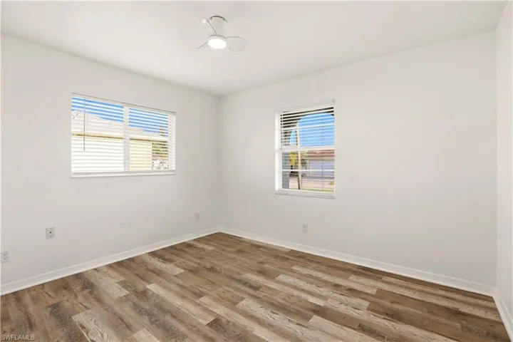Unfurnished room featuring healthy amount of natural light and light wood-type flooring