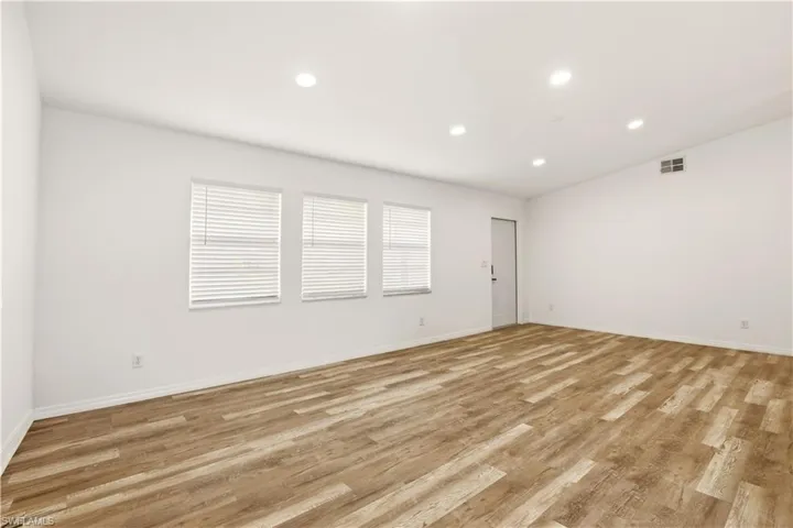 Empty room with recessed lighting and light wood finished floors
