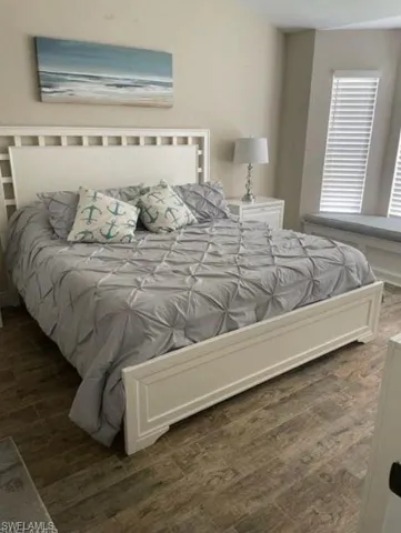 Bedroom featuring dark hardwood / wood-style flooring
