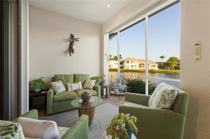 Sunroom with a water view