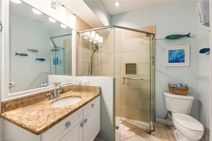 Bathroom 2 with vanity and a stall shower
