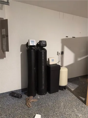 Detailed view of a water softener system and electric panel