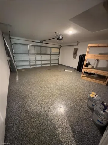 Garage featuring electric panel