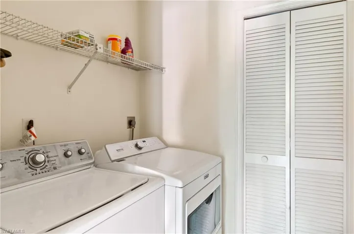 Laundry room featuring separate washer and dryer