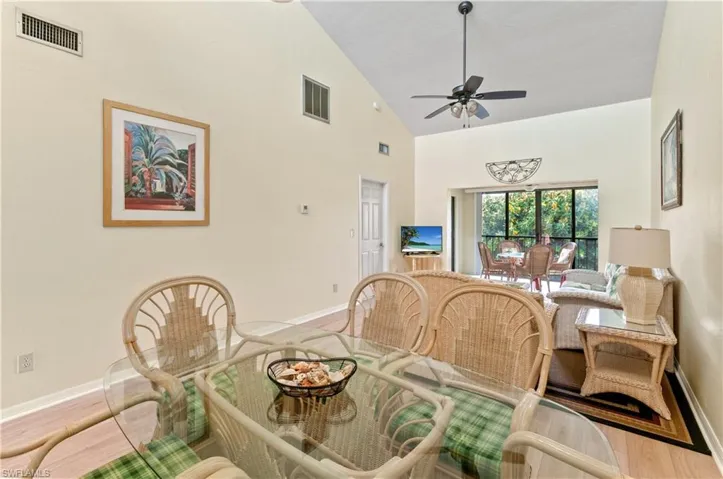 Dining room with ceiling fan and lofted ceiling