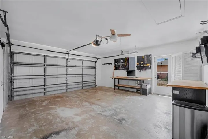 Spacious garage with side entry door