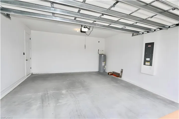 Garage with electric panel and electric water heater