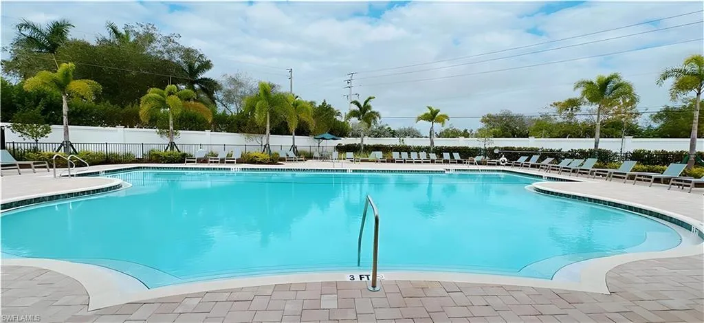 Community pool with a patio area