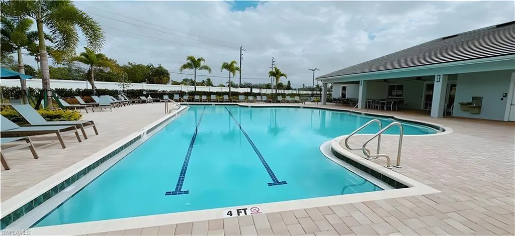 Community pool featuring a patio area