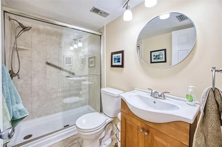 Full Bathroom with vanity and a stall shower