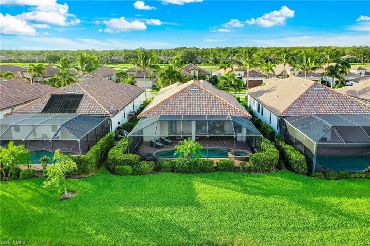 Single family home in Twin Eagles with screened lanai with a pool and built-in spa