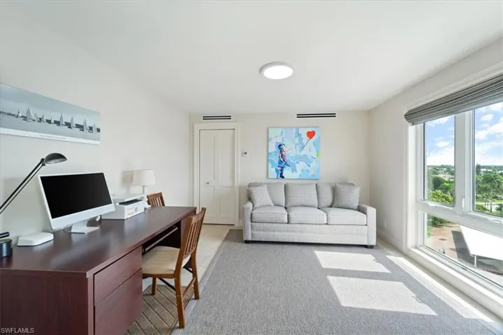 Flexible 3rd Bedroom is being used as a roomy den and work from home space
