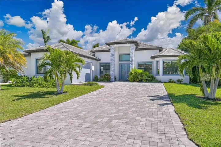 Birds eye view of property with a residential view and a water view