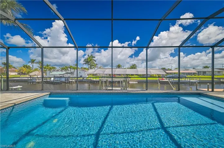 Pool featuring a residential view, a water view, a lanai, and a patio area