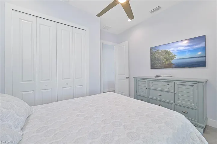 Bedroom featuring visible vents, baseboards, a closet, and a ceiling fan