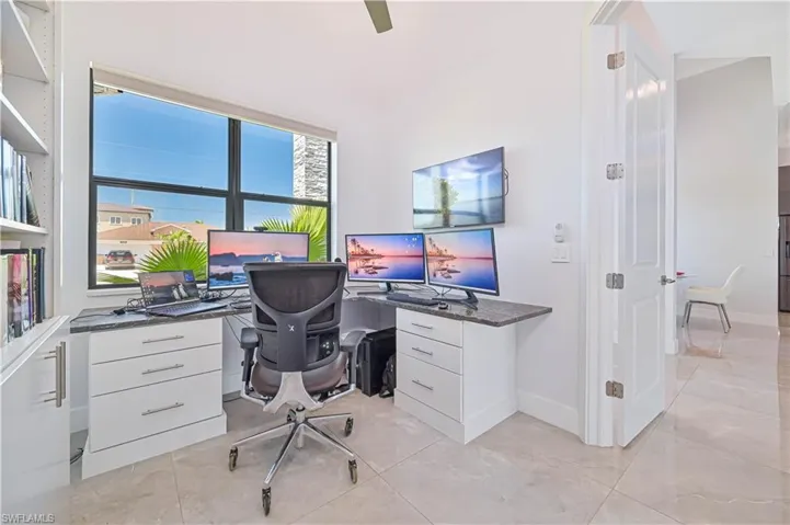 Office area featuring baseboards