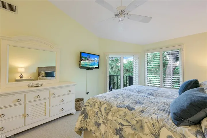 Large and inviting primary bedroom with ensuite, also with a private outdoor balconyoverlooking the lake and preserve.