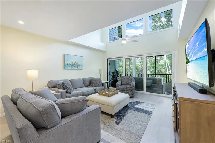 Bright and airy great room with loft above.