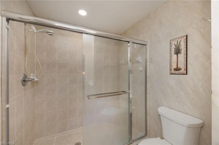 Full bath featuring a shower stall and recessed lighting