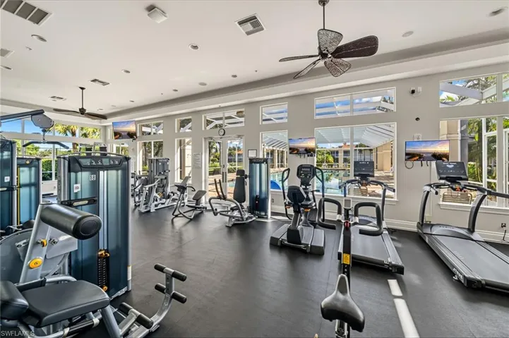 Exercise room featuring recessed lighting and ceiling fan