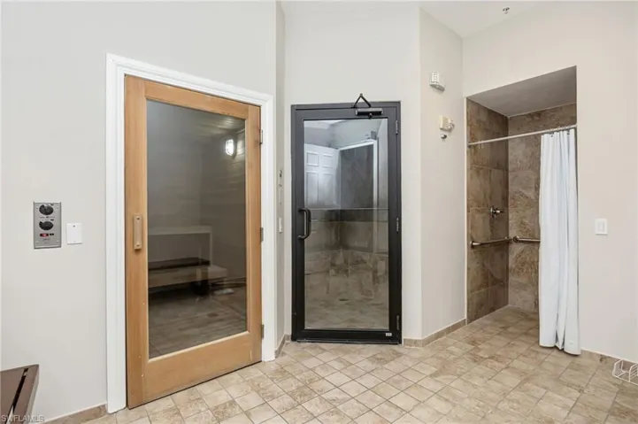Full bath with a relaxing sauna and a stall shower