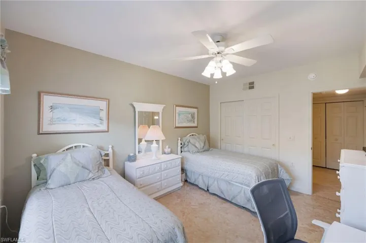 Bedroom featuring a closet and a ceiling fan