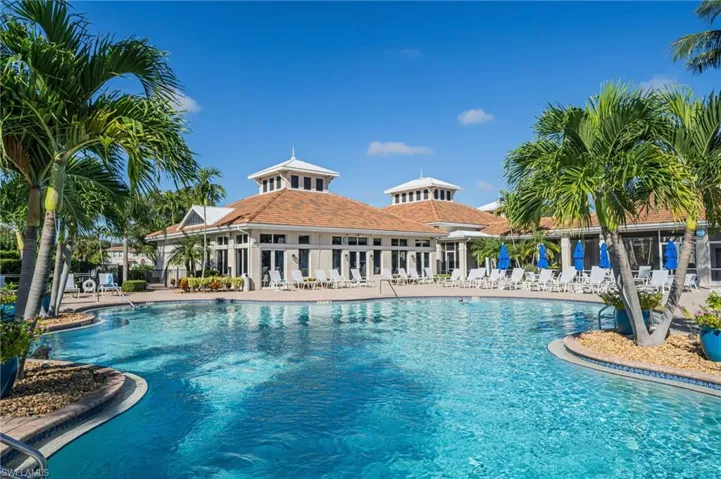 Community pool with a patio sun deck area