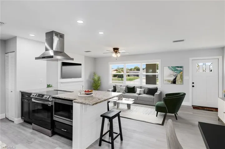 Open concept - Living/Kitchen. Virtually staged