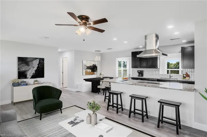 Open concept - Living/Kitchen/Dining. Virtually staged.