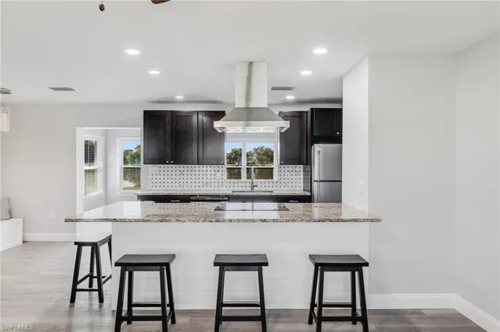 Kitchen with bar seating.