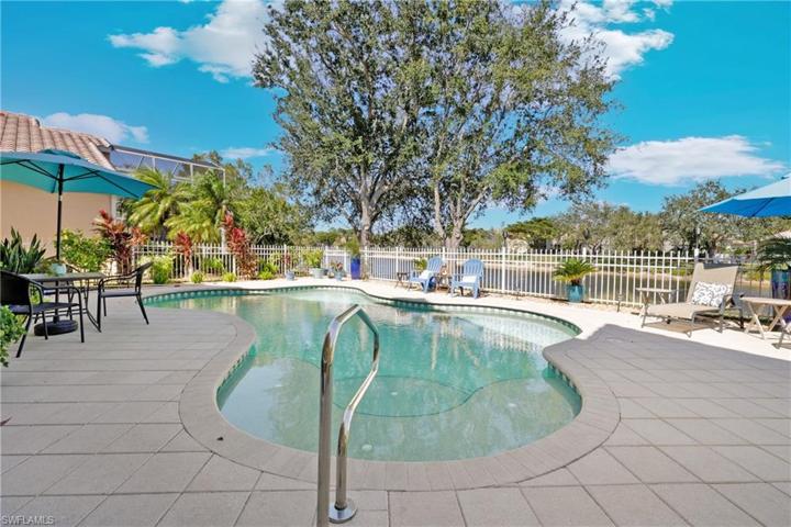 Gorgeous mature landscaping surrounds pool