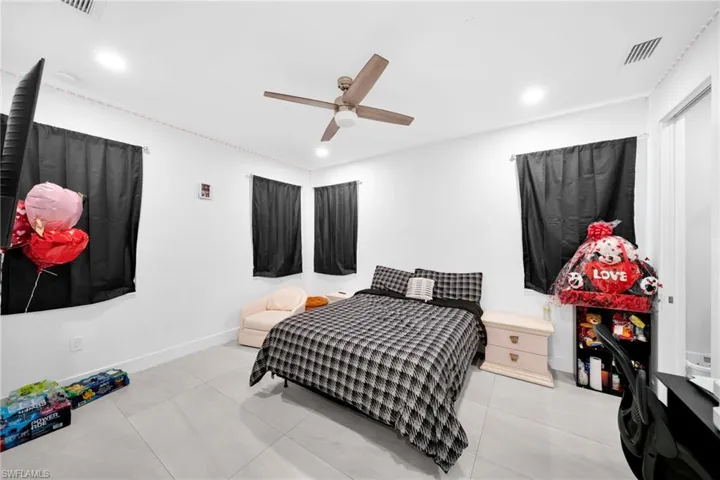 Bedroom featuring a ceiling fan and recessed lighting