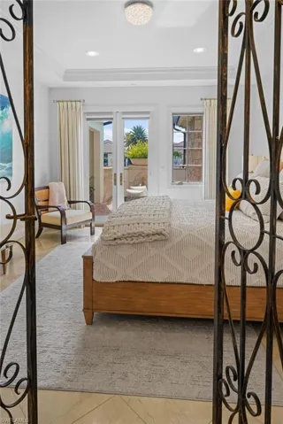 Bedroom featuring french doors and access to exterior