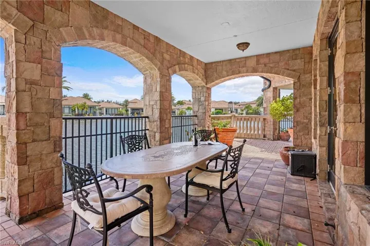 View of patio featuring outdoor dining space and a residential view