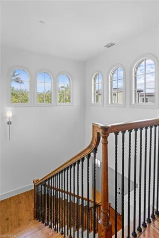 Stairs featuring wood flooring