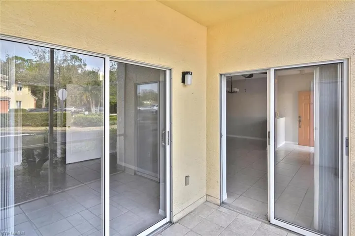 Property entrance featuring stucco siding