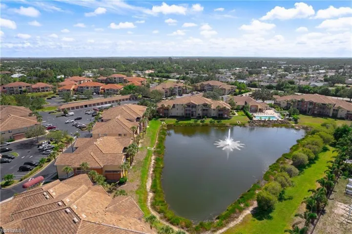 Aerial view of residential area featuring a large body of water