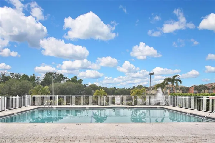 Community pool featuring a patio