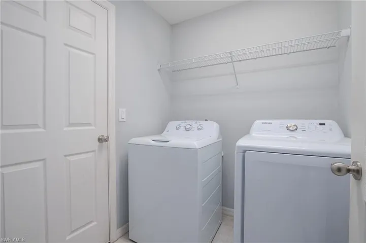 Laundry area featuring washing machine and dryer and laundry area