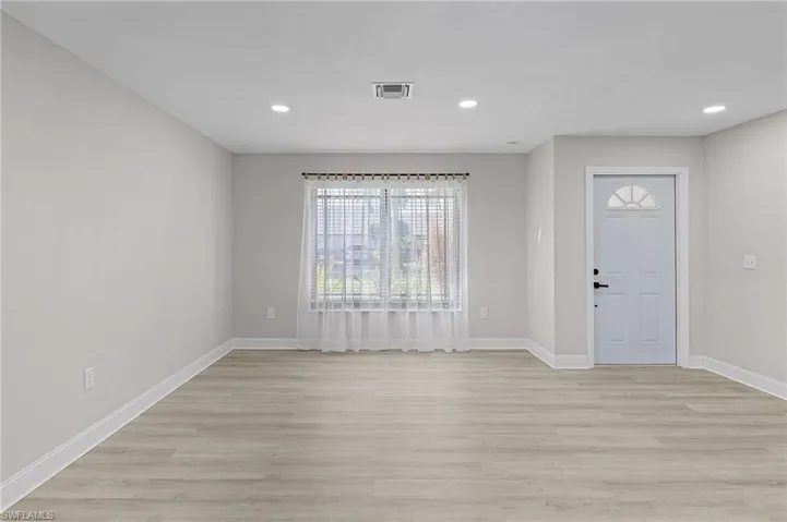 Foyer entrance featuring light hardwood / wood-style flooring