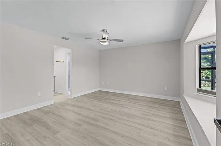 Spare room with ceiling fan and light hardwood / wood-style flooring