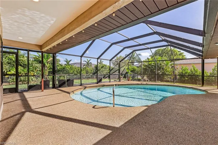 View of pool featuring a lanai and a patio area