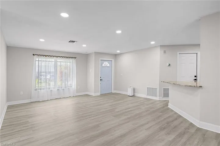 Unfurnished living room featuring light hardwood / wood-style flooring