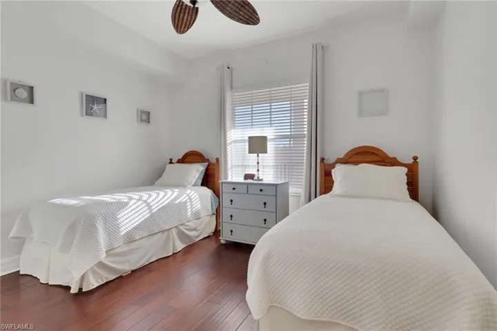 Bedroom featuring wood finished floors and a ceiling fan