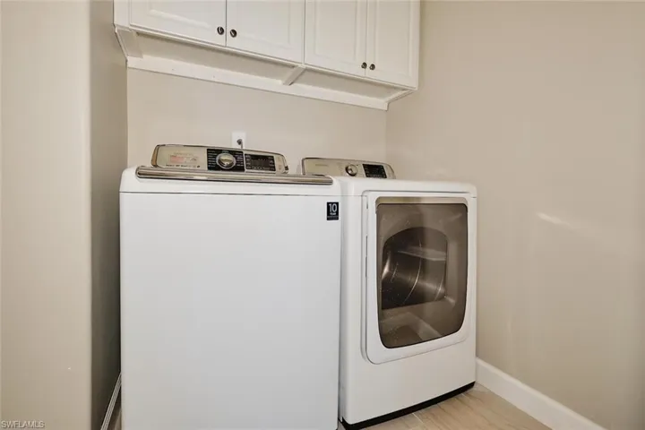 Laundry room featuring cabinet space and washing machine and dryer