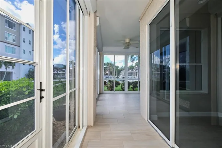 Unfurnished sunroom featuring french doors