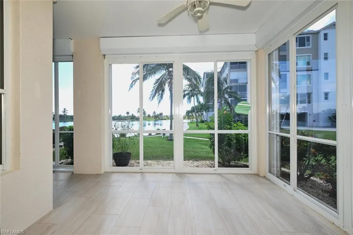 Unfurnished sunroom featuring a water view