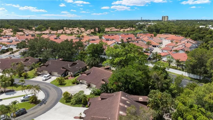 Aerial view of property's location with nearby suburban area.
