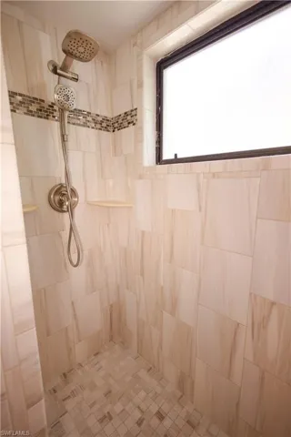 Bathroom featuring tiled shower